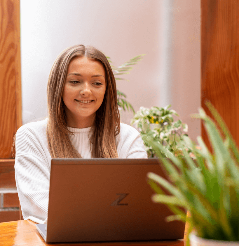 An Alphabyte IT team member working on a laptop